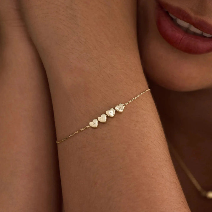 Heart initial bracelet styled on a wrist