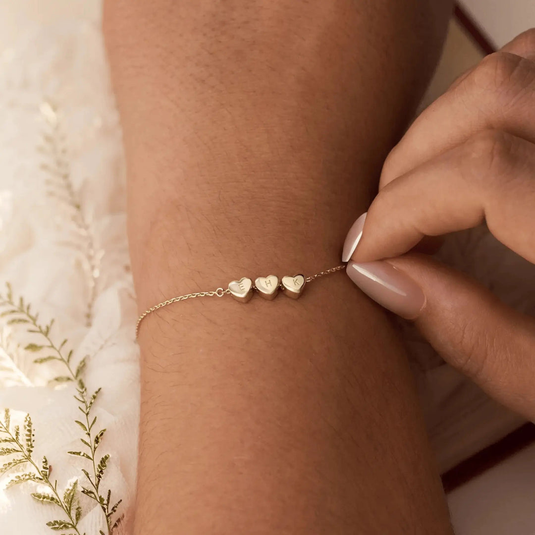 Custom heart initial bracelet with multiple hearts