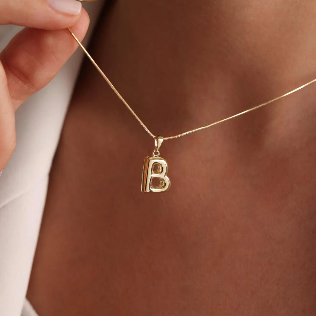 Bubble letter necklace packaged for gifting