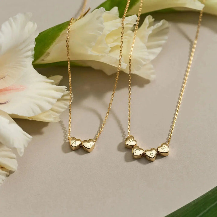 Heart necklace with engraved letters detail