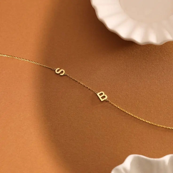 Sideways initial bracelet styled on a wrist