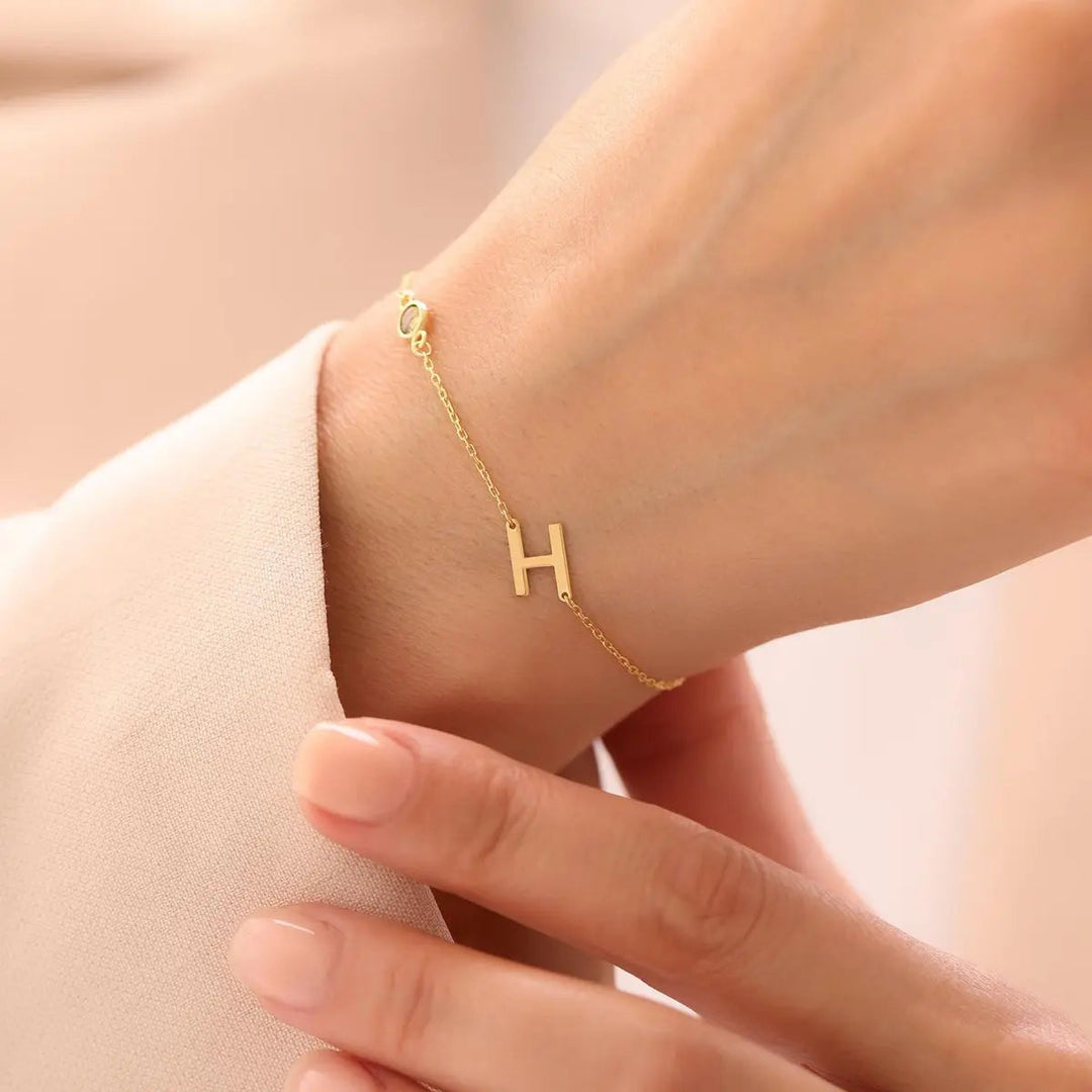 Sterling silver sideways initial bracelet detail