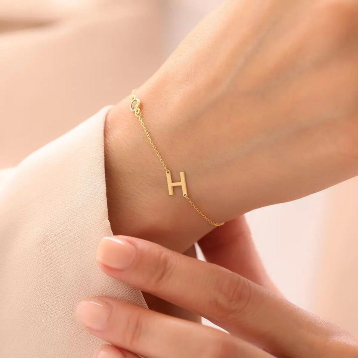 Sterling silver sideways initial bracelet detail