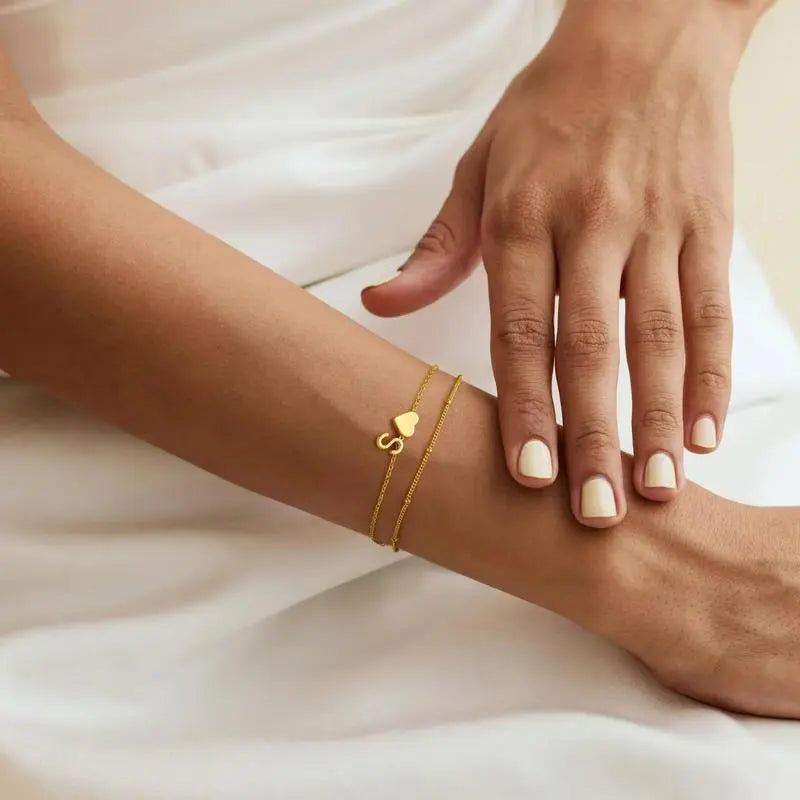 Heart initial bracelet styled on a wrist