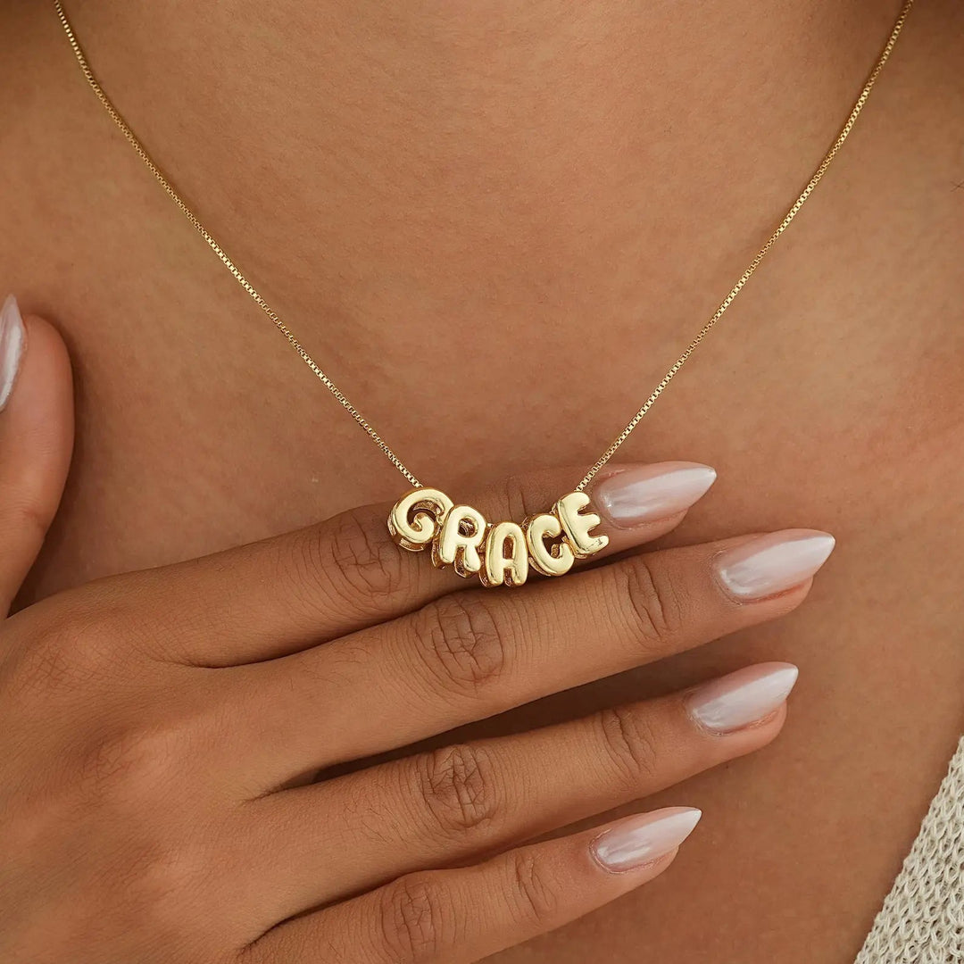 Tiny balloon letter name necklace in gold
