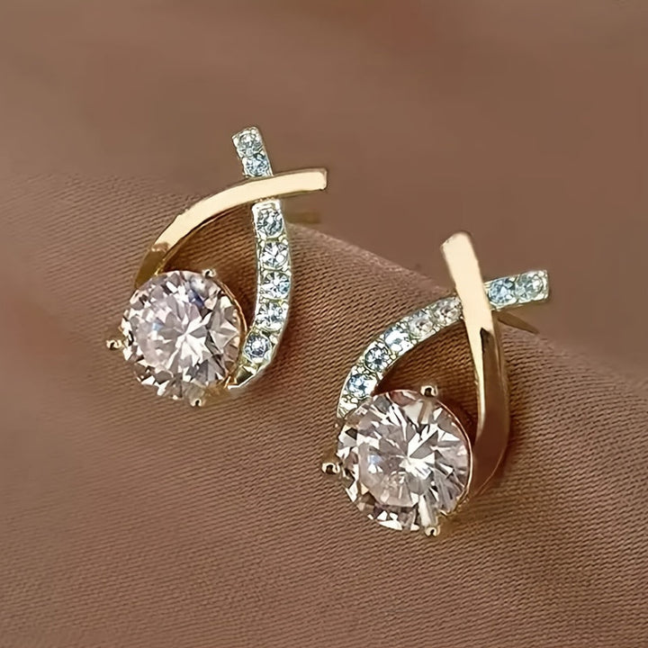 Stud earrings with golden cross and zirconia
