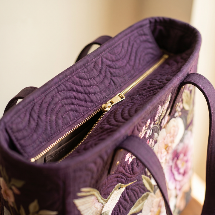 Close-up of quilted stitching and zipper