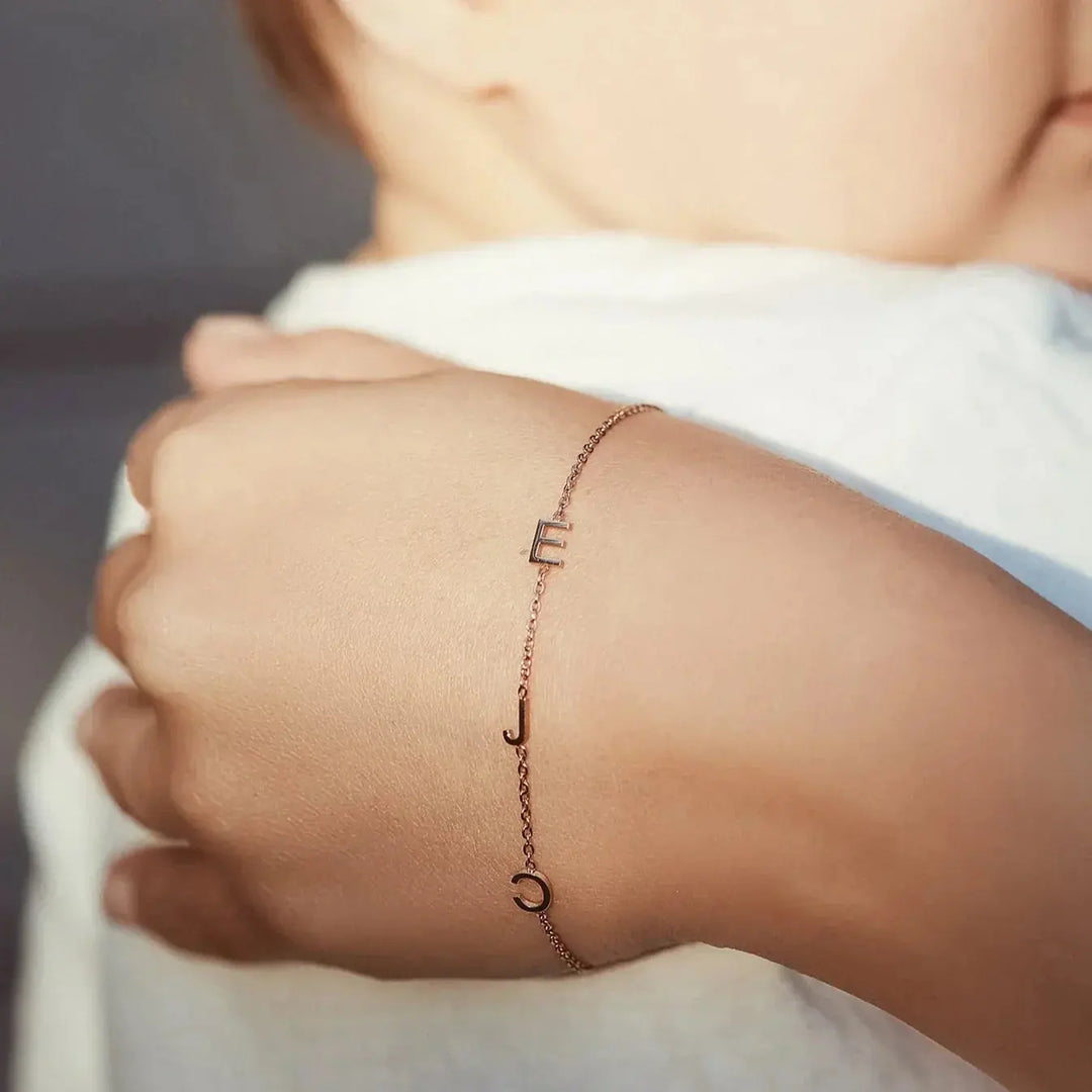 Sideways initial bracelet engraving close-up