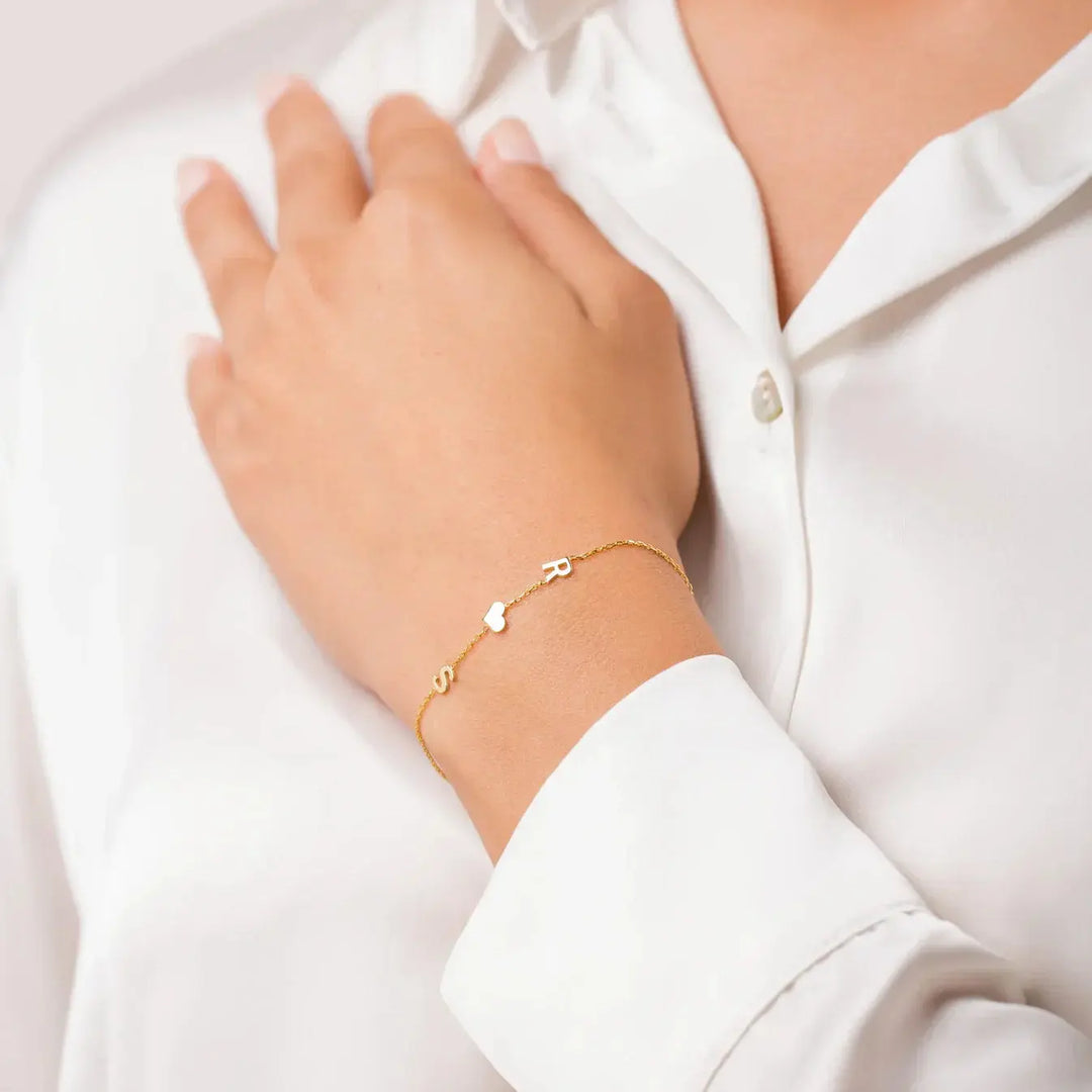 Layered sideways initial bracelet stack