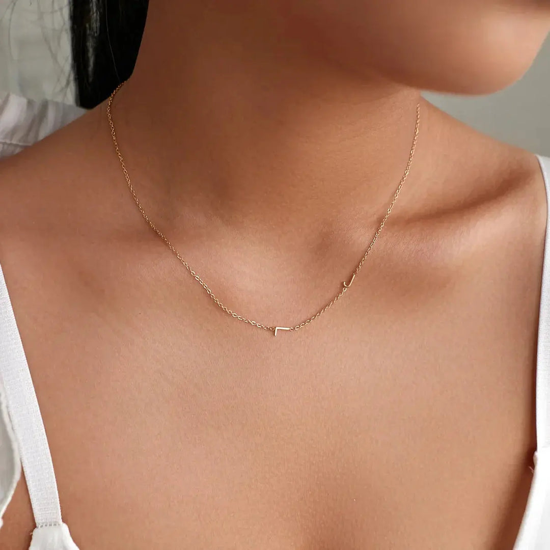Sideways initial necklace in rose gold